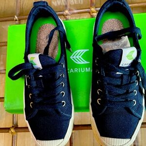 Cariuma navy canvas sneakers in excellent condition.